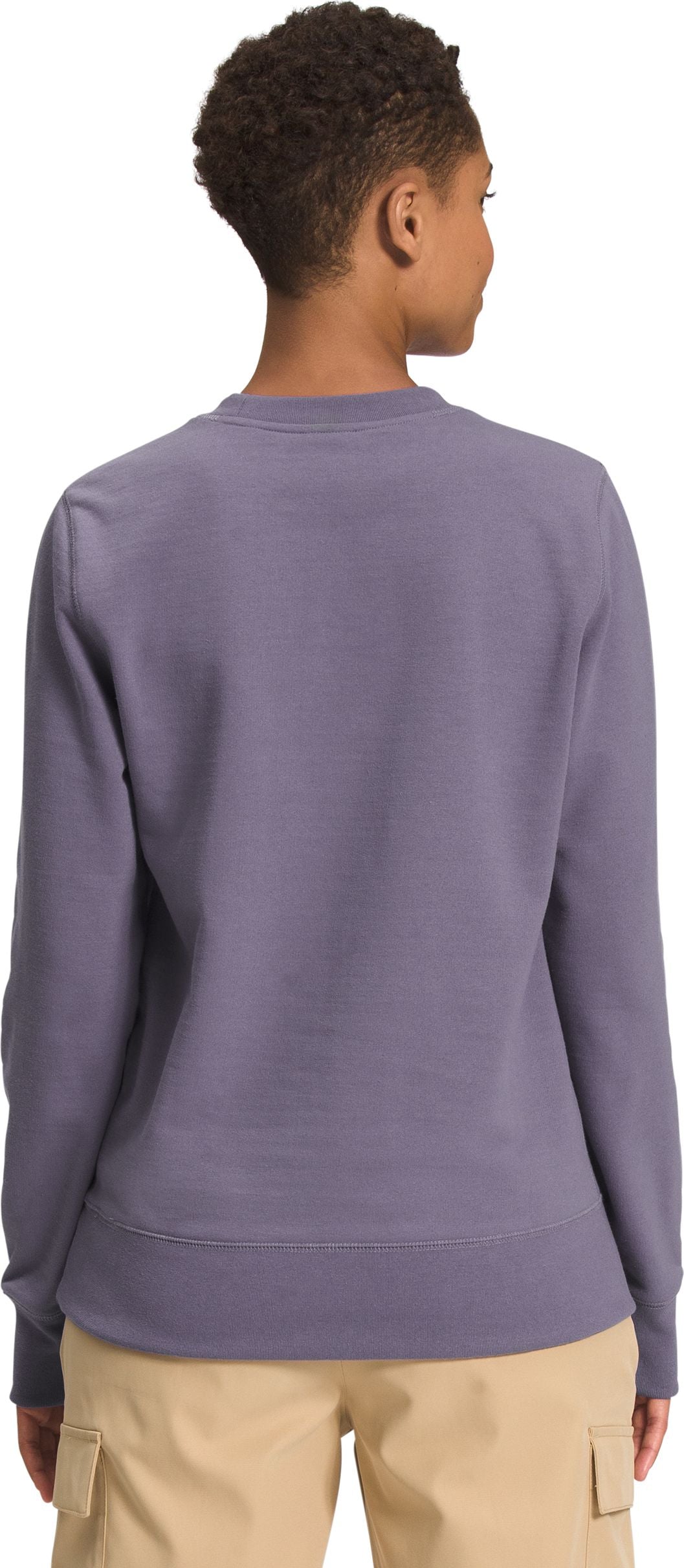 Lavender-colored sweater on a person from the back.