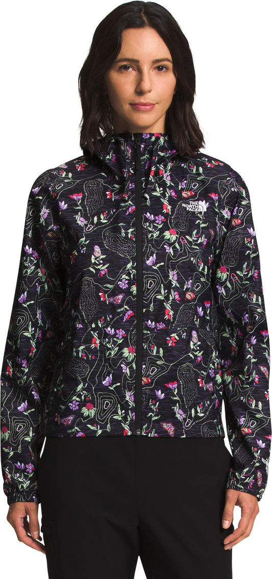 A woman wearing a floral jacket.