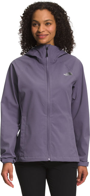 A woman wearing a muted purple hooded jacket.