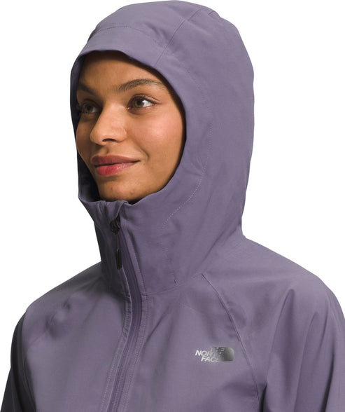 Close-up of a woman in a light purple hooded jacket with the The North Face logo visible.