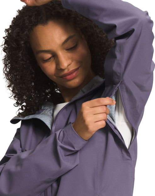 Woman in purple rain jacket with open pit zip.