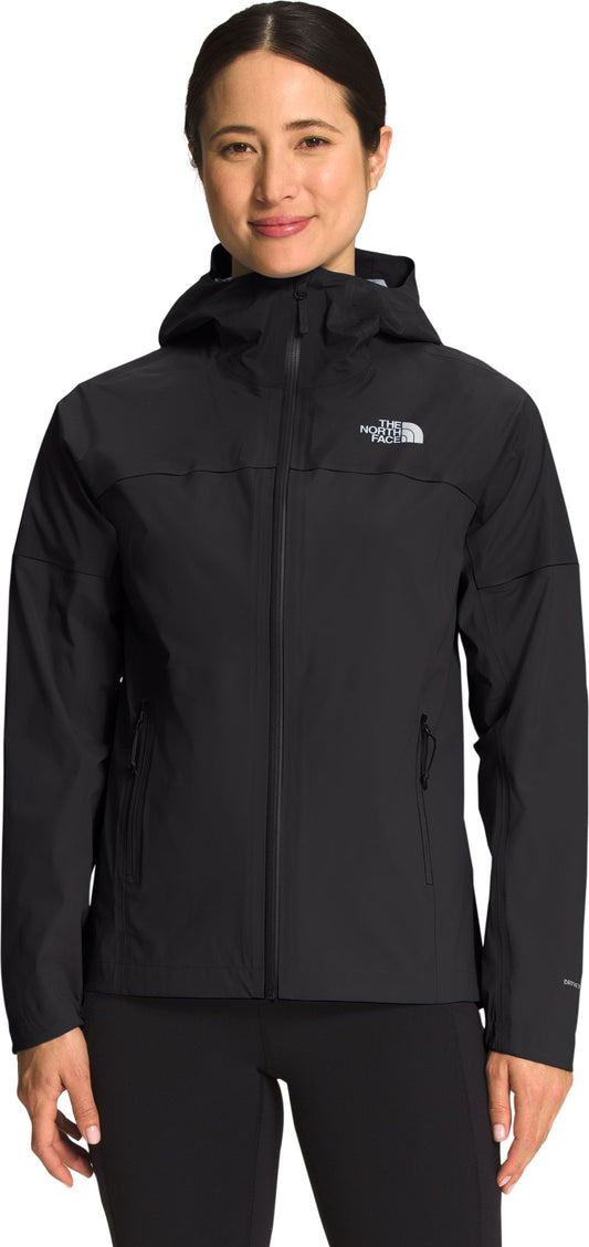 A woman in a black rain jacket with a hood.