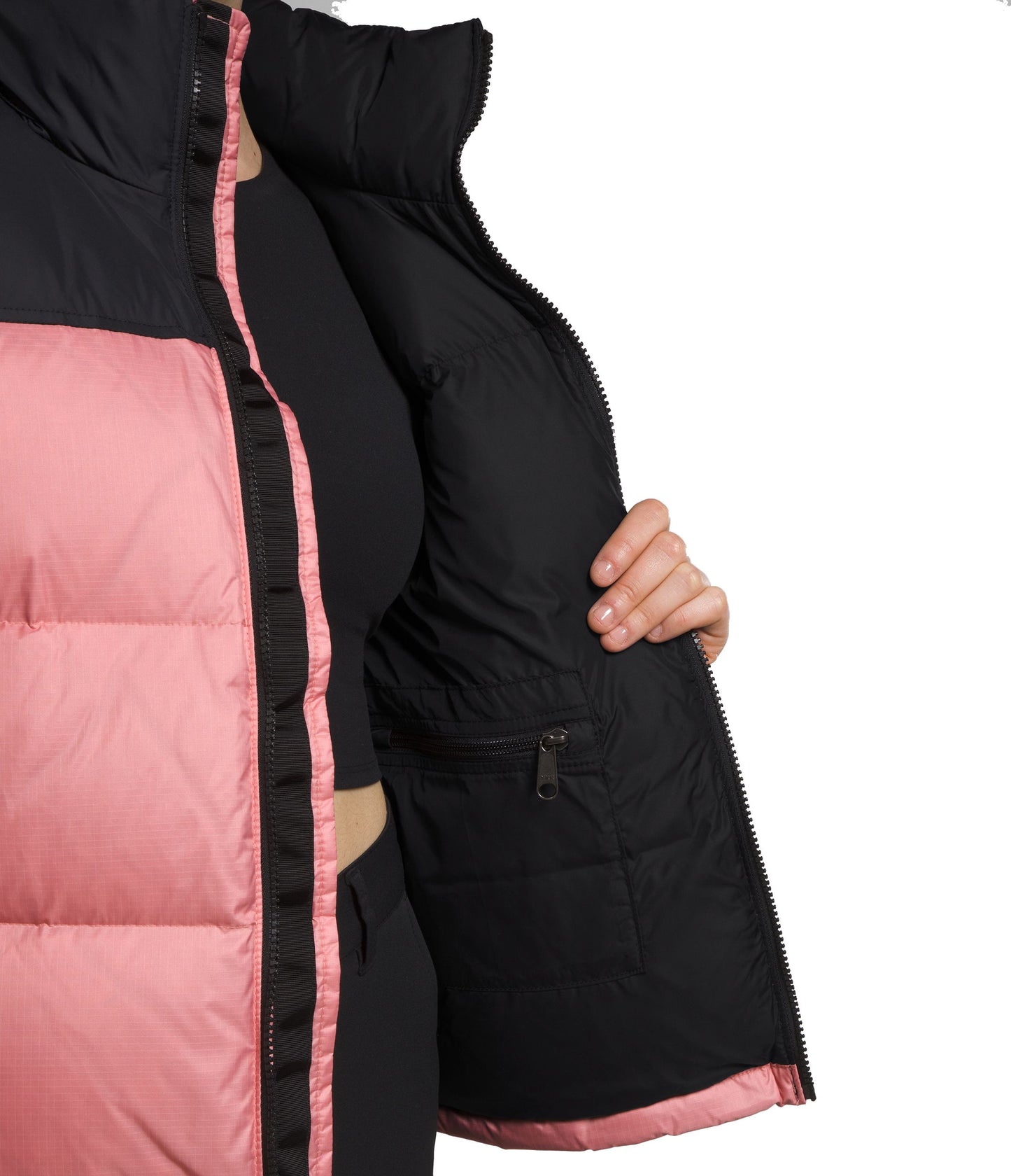 Cropped view of a pink and black puffer vest with a black interior, showing a zippered pocket.