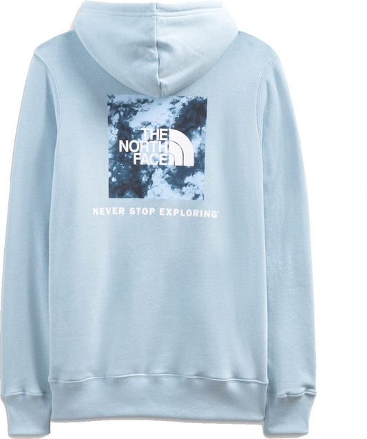 Light blue hoodie with a white box logo on the back containing a blue-white cloud design with the words "THE NORTH FACE" and "NEVER STOP EXPLORING" in white.