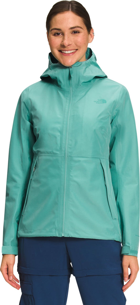 A woman wearing a hooded rain jacket.