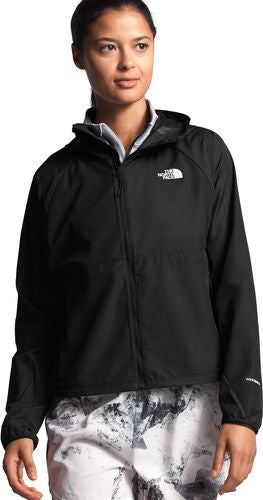 A person wearing a black zippered hooded jacket.