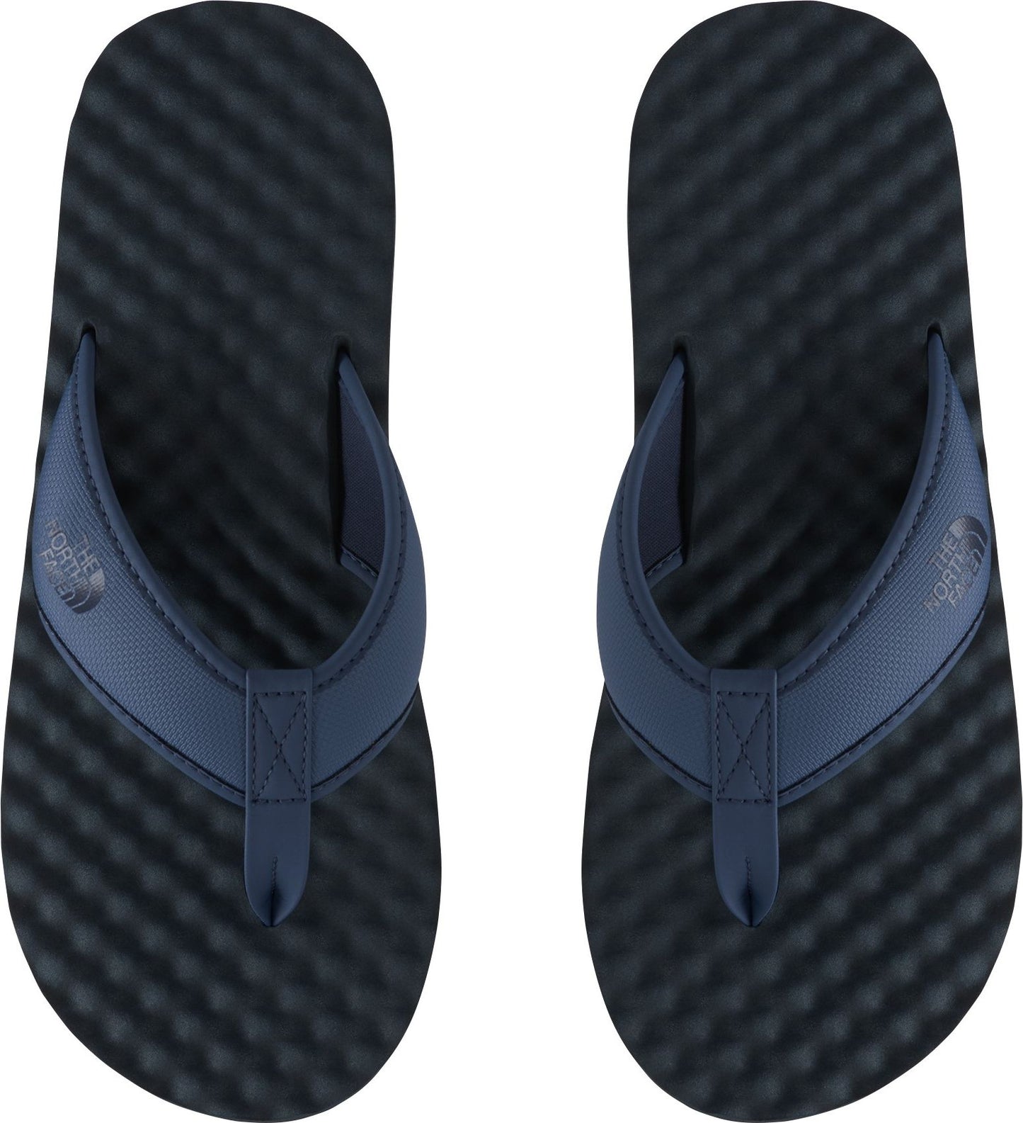 Pair of navy blue flip-flops, top view.