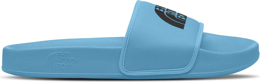 A light blue slide sandal featuring a black logo on the strap.