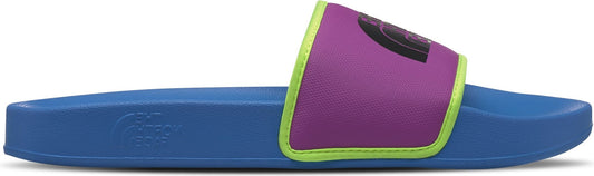 A blue slide sandal with a purple strap outlined in neon green.