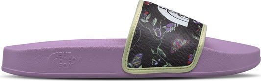 A purple slide sandal with a floral patterned strap.