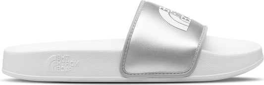 A white slide sandal with a silver strap featuring a logo.