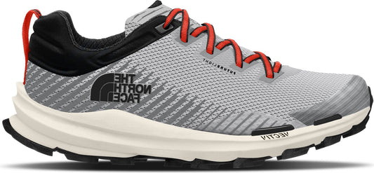 A gray running shoe with orange laces, black details and a white sole.