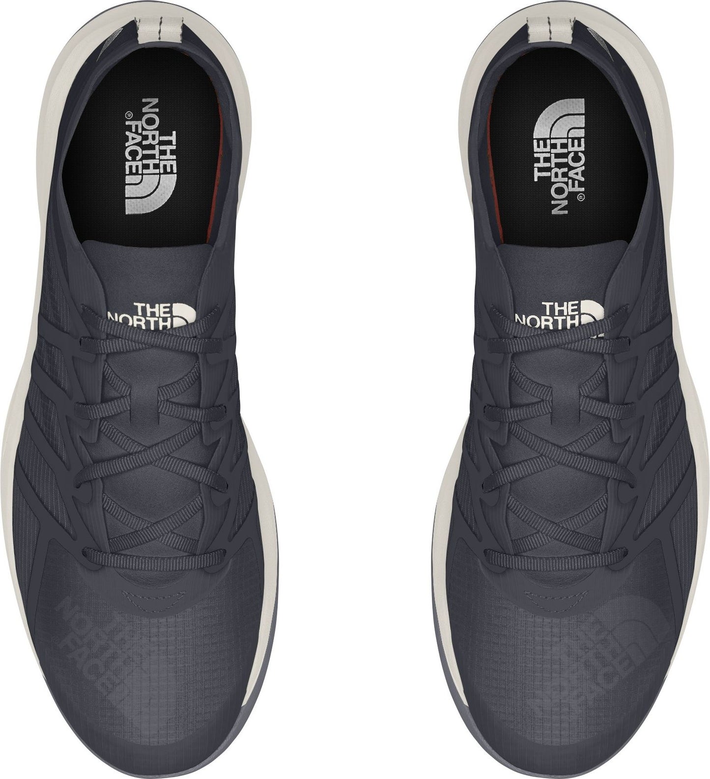 Overhead view of two dark gray athletic shoes with white soles and white laces.