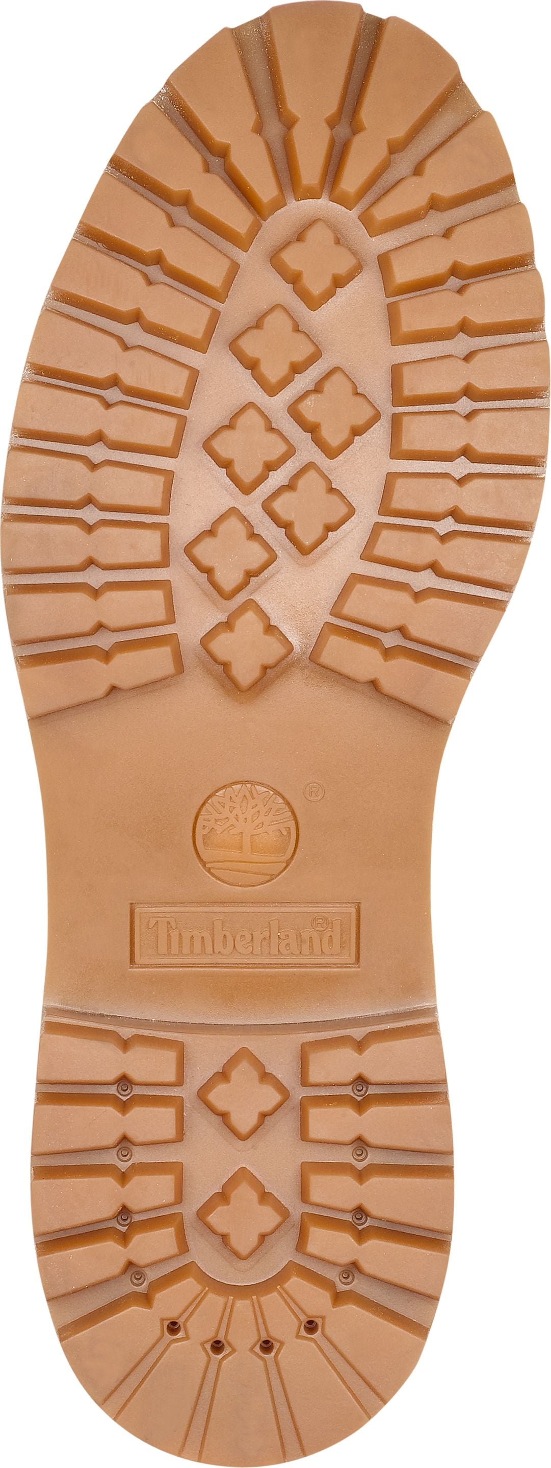 The tan-colored outsole of a shoe features a pattern of rectangular and four-pointed star-shaped treads, along with visible branding.