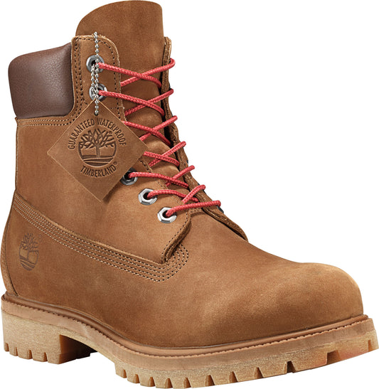 Tan work boot with red laces, a brown padded collar, and a waterproof guarantee tag.