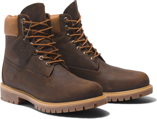 Pair of brown leather boots with laces and tan collars.