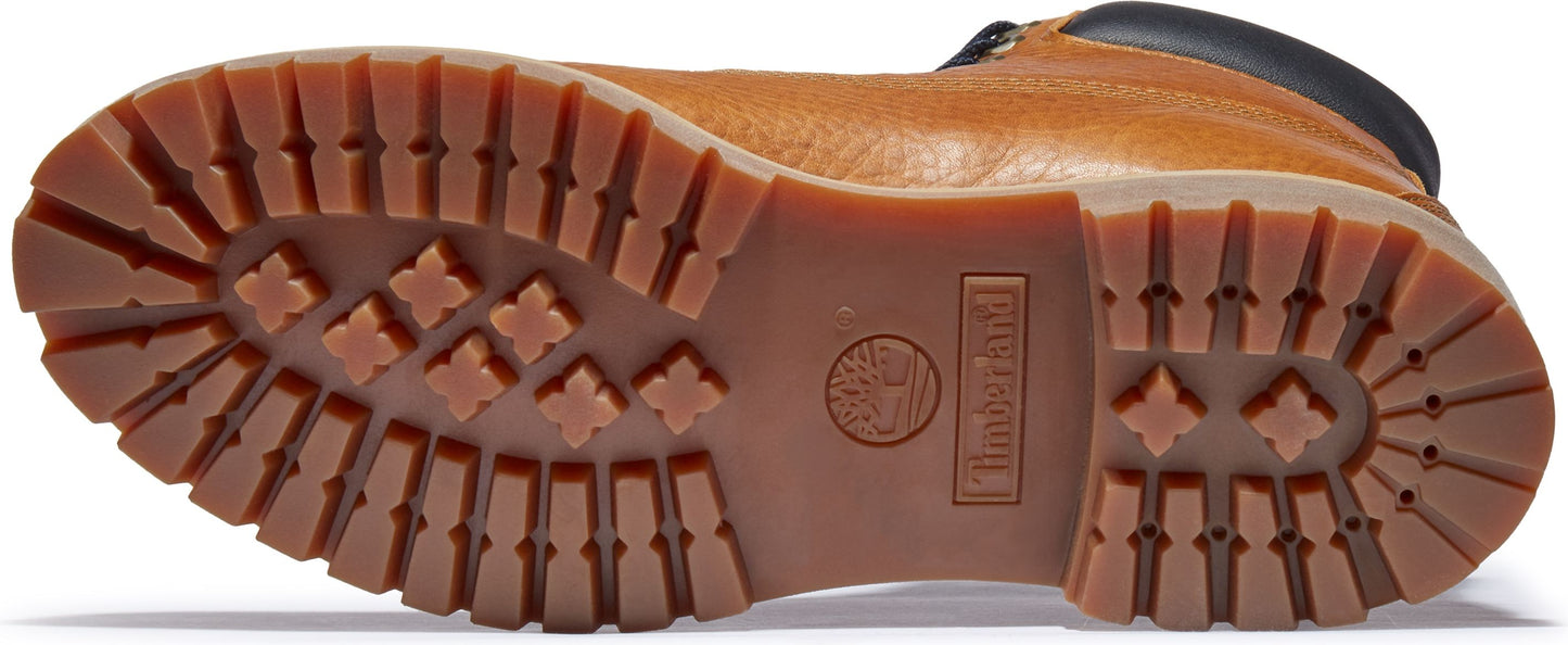 A shoe's lug sole has a logo that reads 'Timberland'.