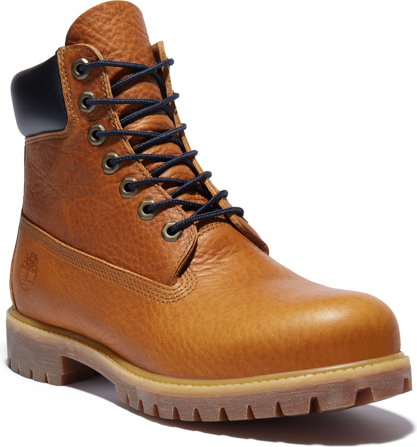 Tan leather work boot with black laces and dark blue padded collar