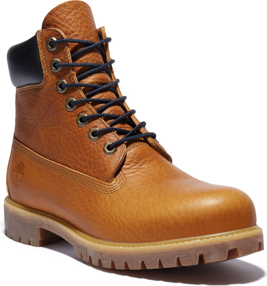 Tan leather work boot with black laces and dark blue padded collar