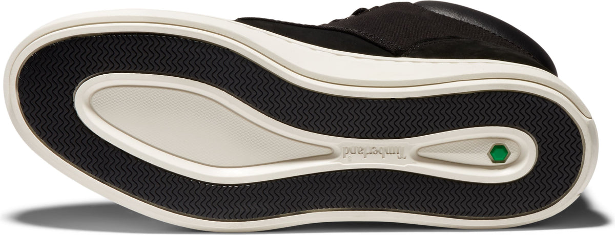 shoe sole featuring a black and white color scheme with a prominent green detail.