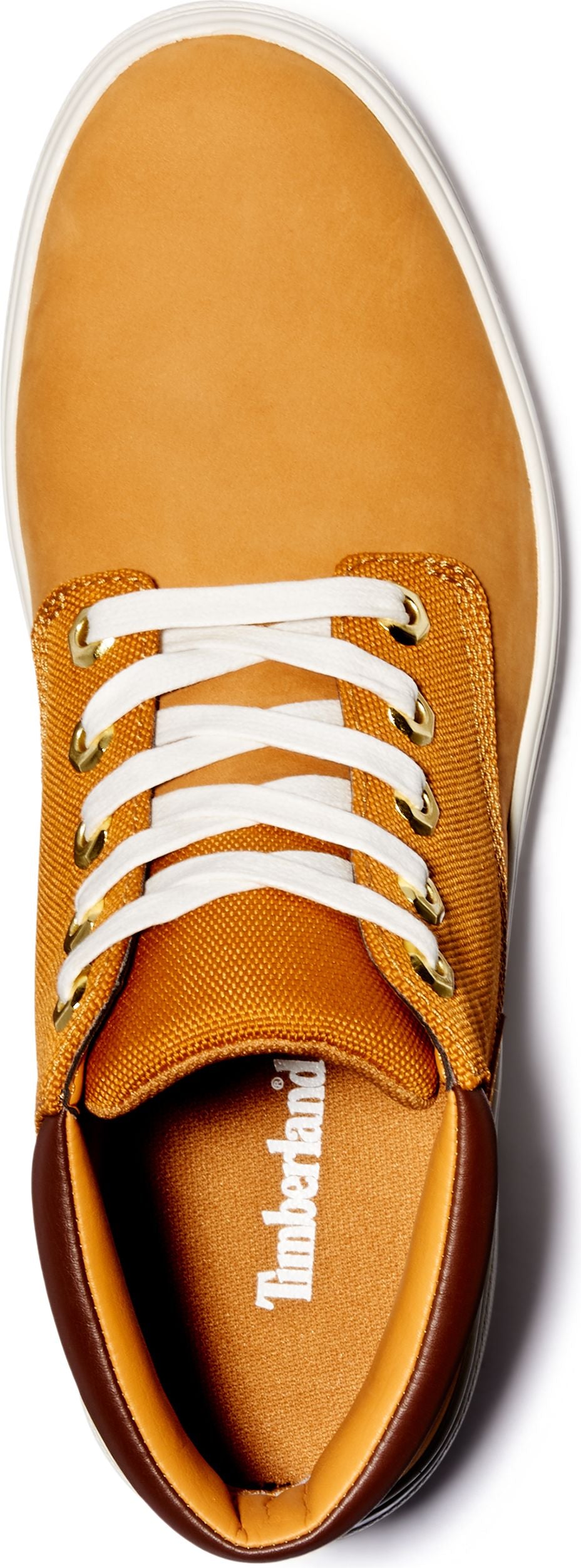 A tan casual shoe with white laces.
