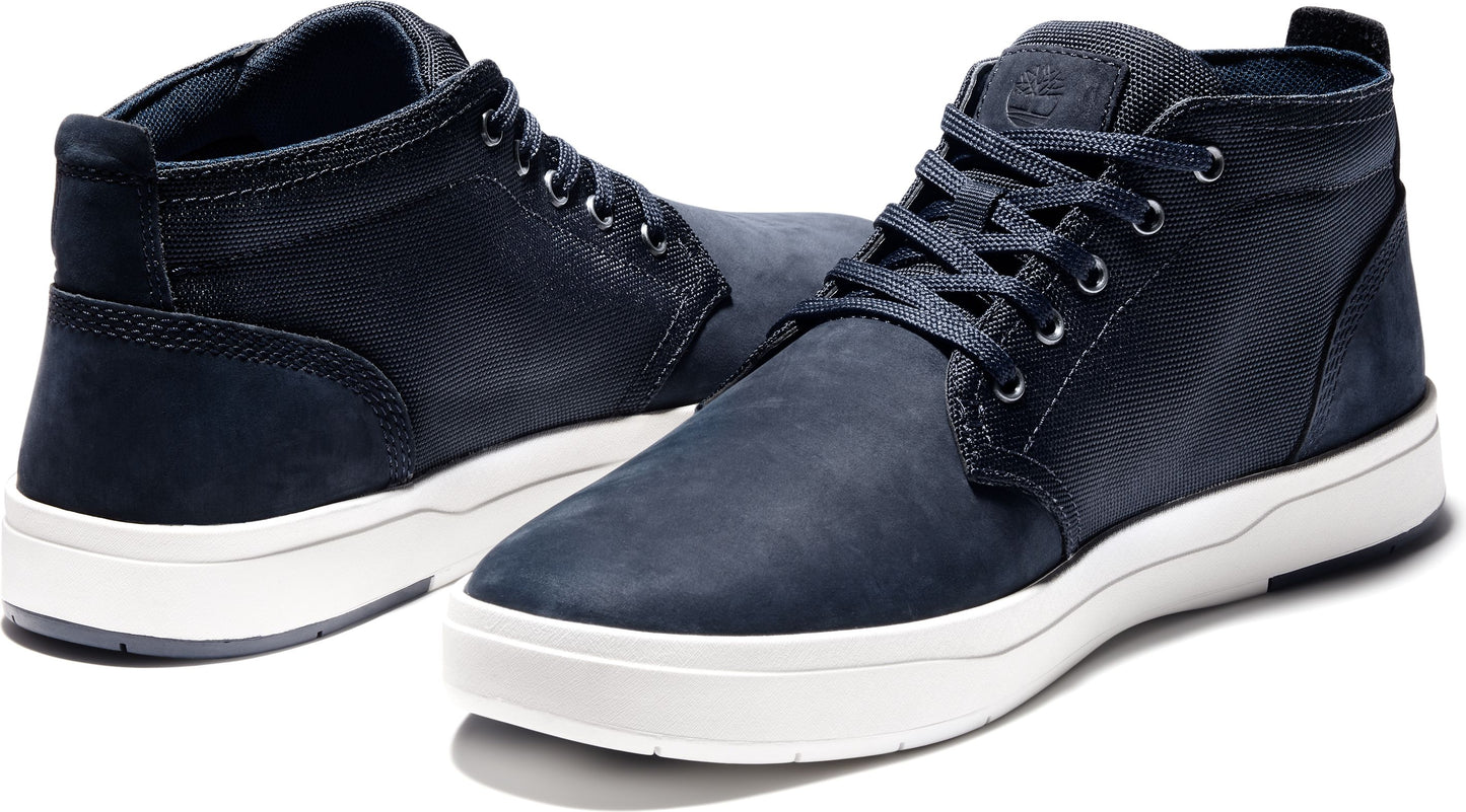 A pair of navy blue chukka sneakers with white soles.