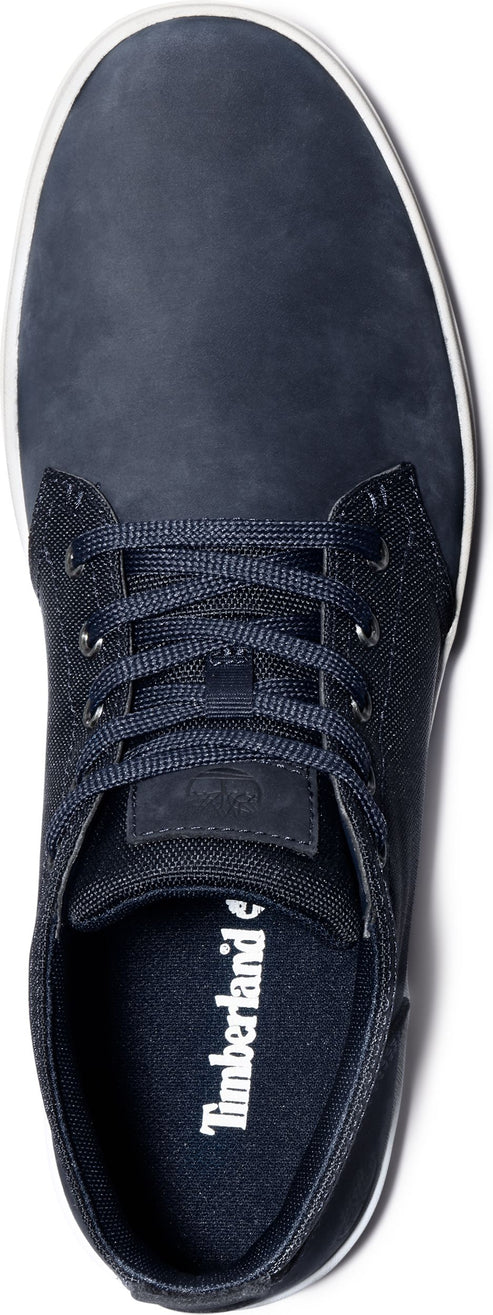 A navy blue low-top sneaker with white sole and laces.