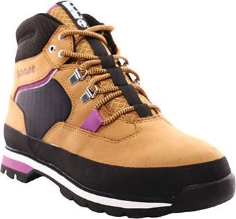 Tan hiking boot with black sole, purple accent, laces and silver eyelets.