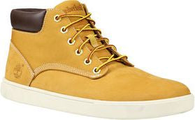 Tan leather mid-top shoe with brown collar and yellow laces on a white sole.