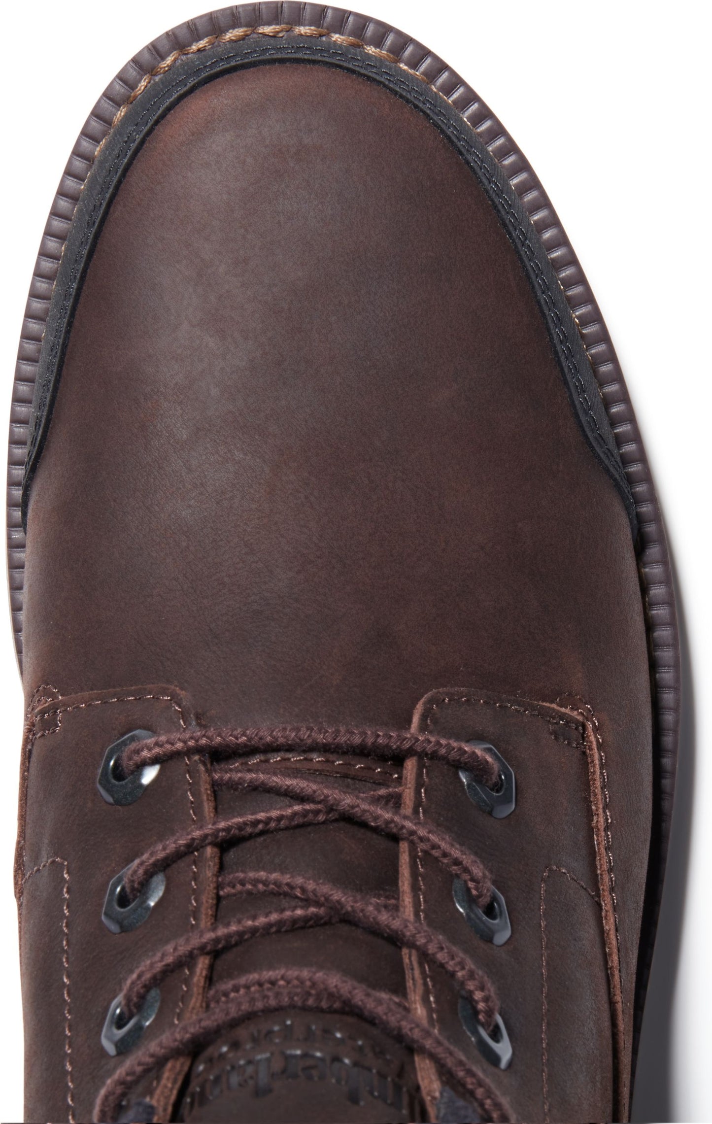A top-down close-up view of the toe and lace area of a dark brown work boot with a black sole.