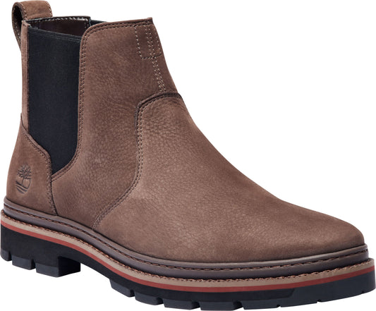 A brown leather Chelsea boot with a lug sole and black elastic side panels.
