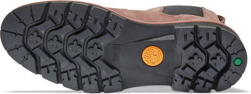 A boot outsole features a black tread pattern with shapes resembling clovers and small rectangles.