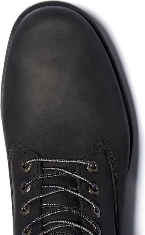 Close-up of a black leather boot with a rounded toe and black and gray laces.