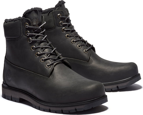 Pair of black leather work boots with faux fur lining.