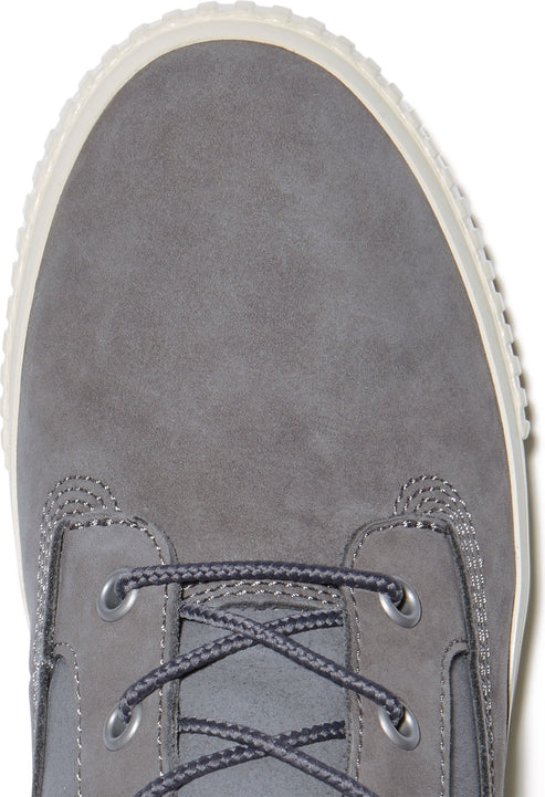Close-up of a grey suede boot featuring a lace-up closure with dark grey laces.