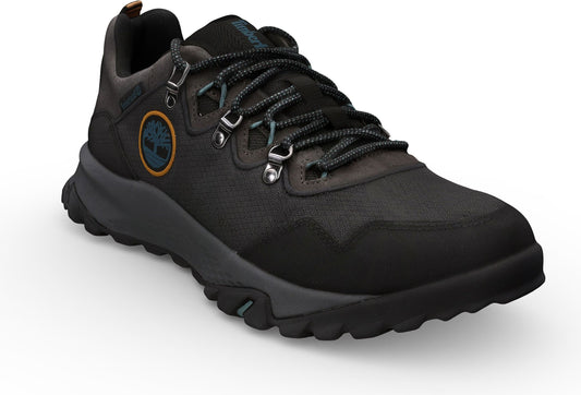 A low profile hiking shoe with black upper, gray midsole and sole, and metal lace eyelets.