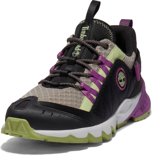 Athletic shoe with a black toe, a beige mesh midsection, purple eyestay bands, and a black ankle, contrasted by a white jagged sole with green and purple accents.