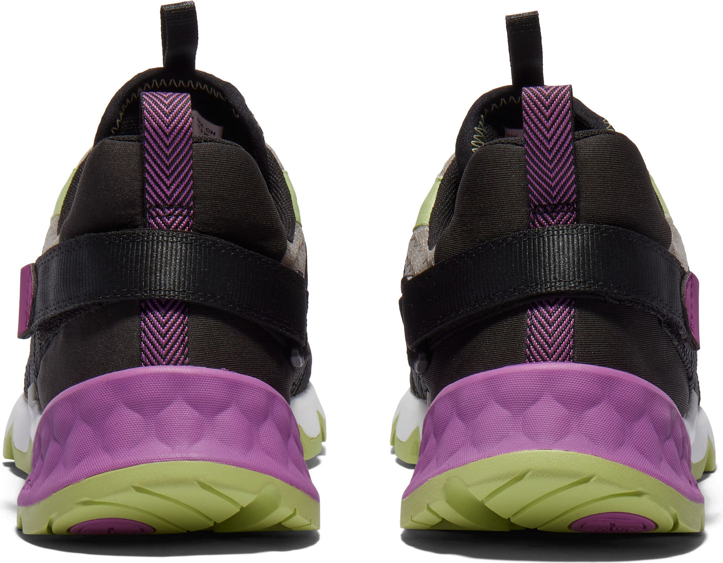 Pair of sneakers featuring black straps, purple accents, and green outsoles viewed from the rear.