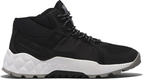 Black and white mid-top hiking shoe with a textured white sole.