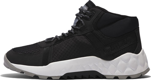 Black and white high-top athletic shoe with geometric-patterned sole and speckled laces.