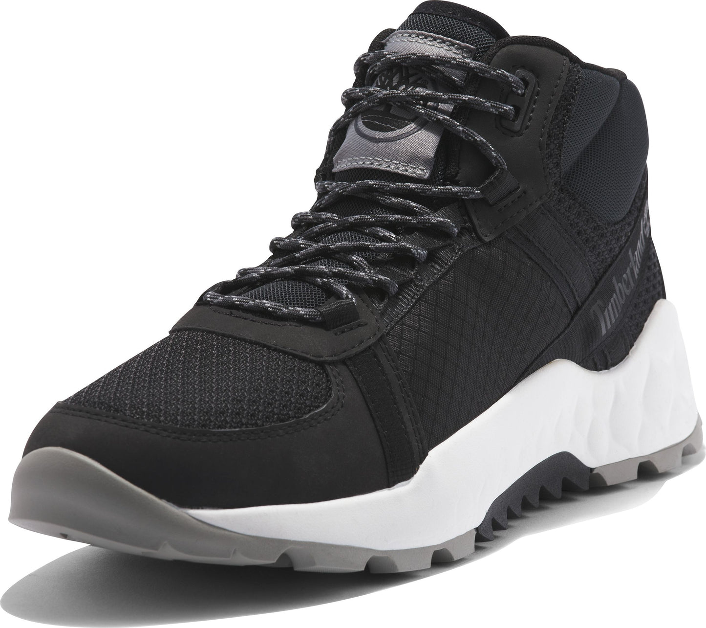 A black mid-top athletic shoe with gray laces and sole.