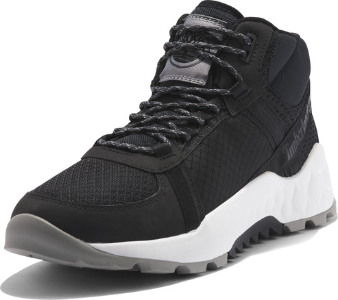 A black mid-top athletic shoe with gray laces and sole.