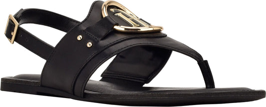 A black sandal with a gold emblem.