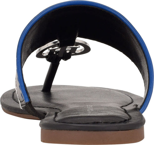 Close-up of a black sandal with a blue stripe along the top edge and a silver-colored decorative piece.