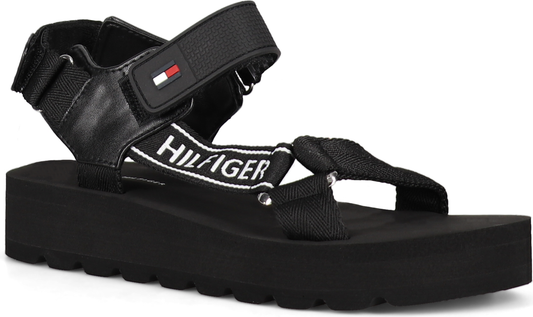 Black platform sandal with multiple straps, one with "HILFIGER" text.