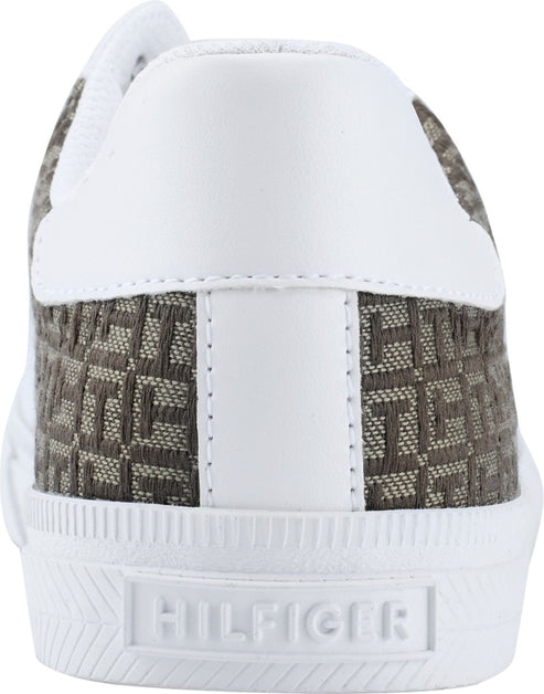 Rear view of a sneaker featuring white leather accents and brown patterned canvas with visible "HILFIGER" branding on the heel.