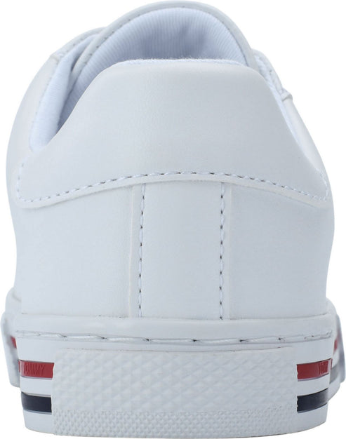 White sneaker with red and blue stripe at heel.