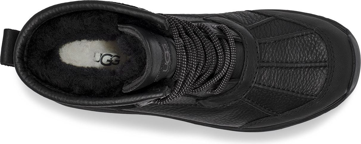 Black UGG boot with laces, visible UGG logo inside.