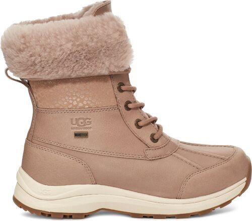 Beige leather boot with fur lining, lace-up closure, and waterproof logo.