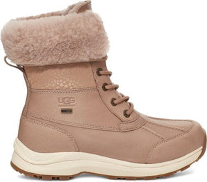 Beige leather boot with fur lining, lace-up closure, and waterproof logo.